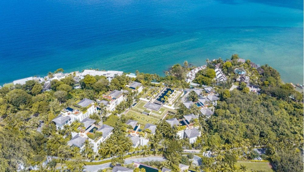 Top view of white beach resort with crystal clear water