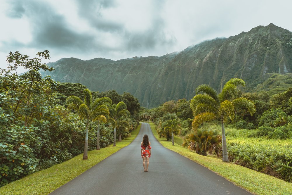 Woman walking the streets of Ho’omaluhia Botanical Garden