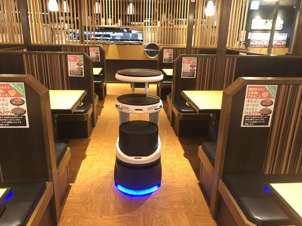 Three robots in a restaurant