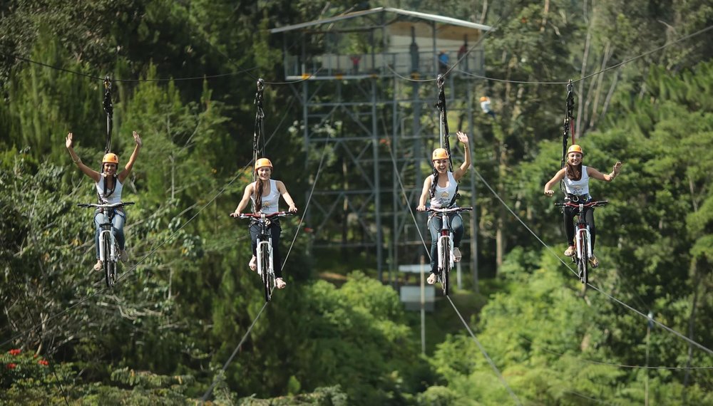 Group of friends trying the sky bicycle