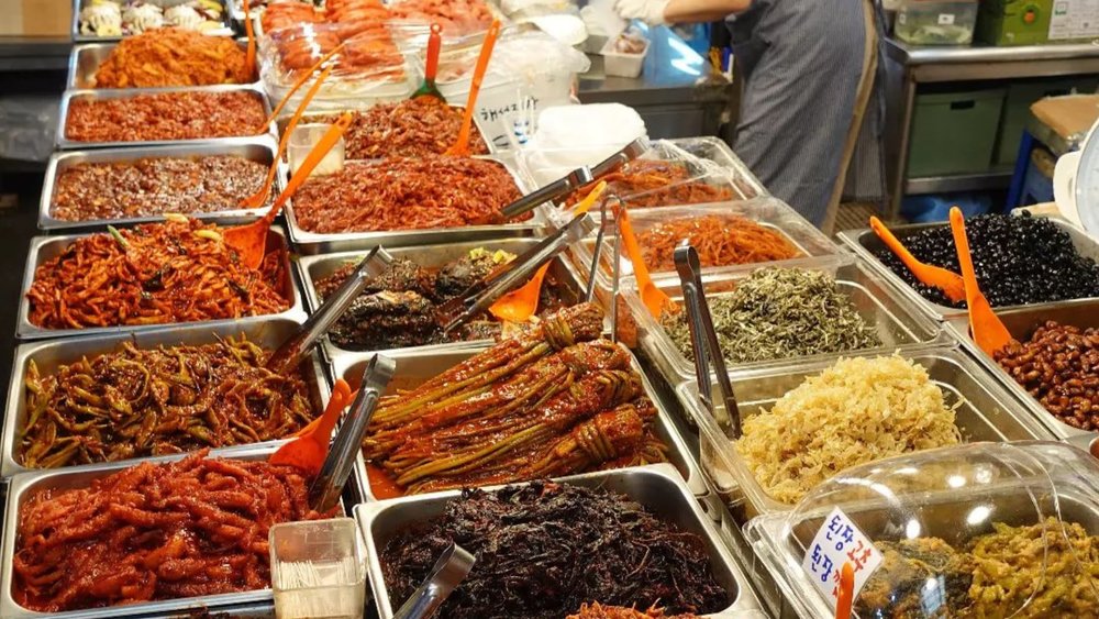 Enjoy gimbap, hotteok, and more at a discount at Gwangjang Market. Credit: neil.and.a.camera