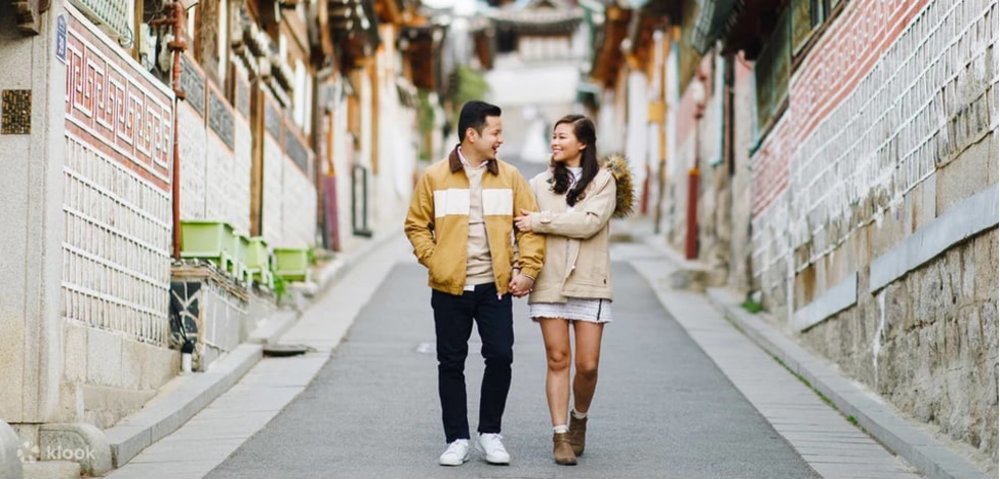 two people walking together in Bukchon Village street