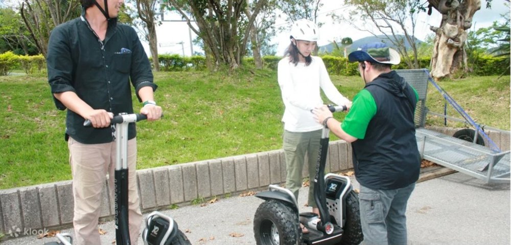 People trying to ride a bike