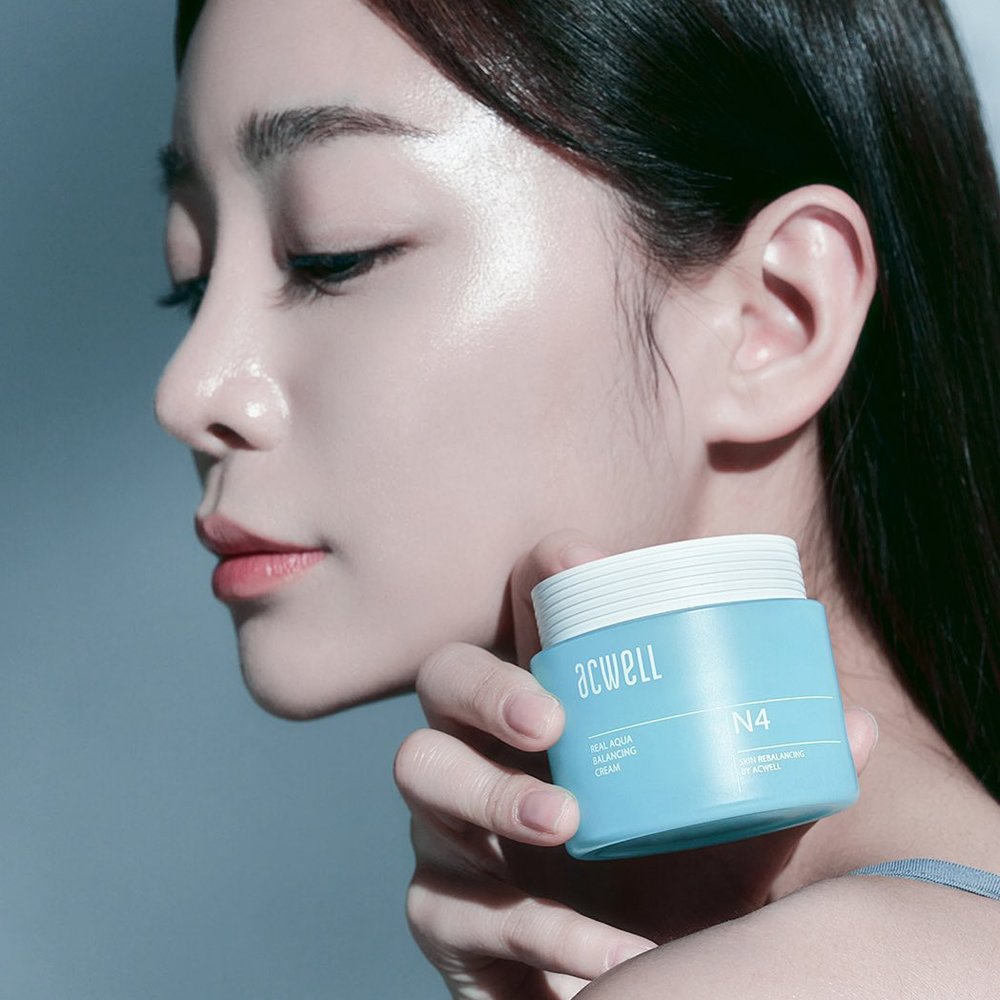 Girl holding a skin care product