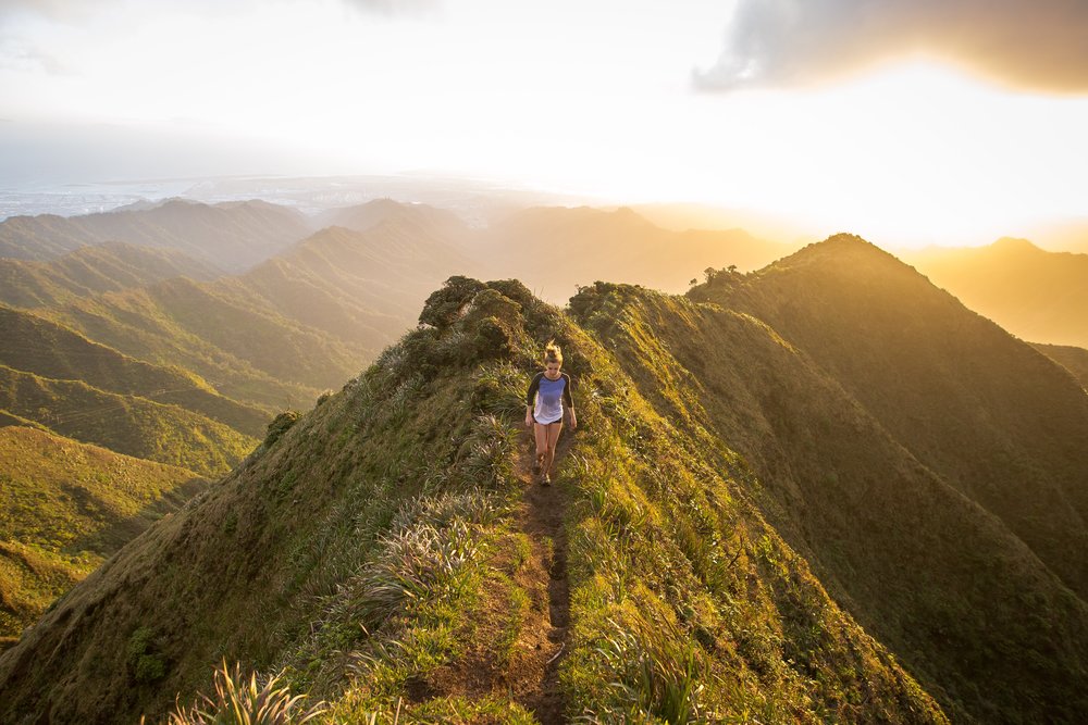 Girl walking in mountain trail