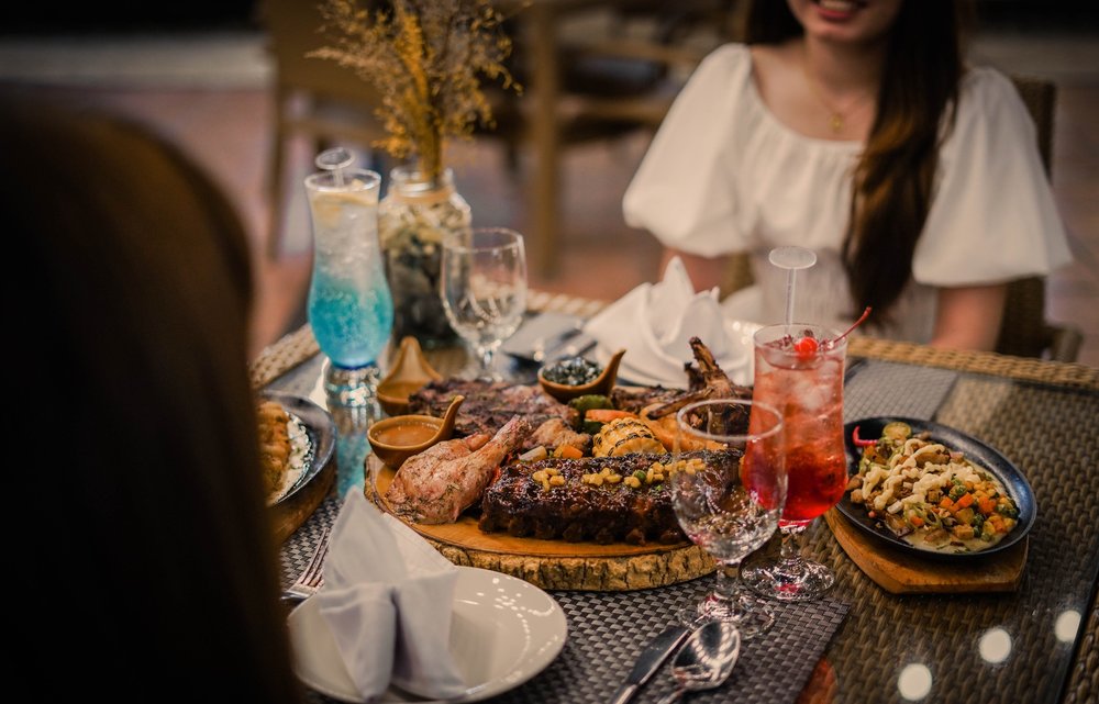Two girls having steak for dinner