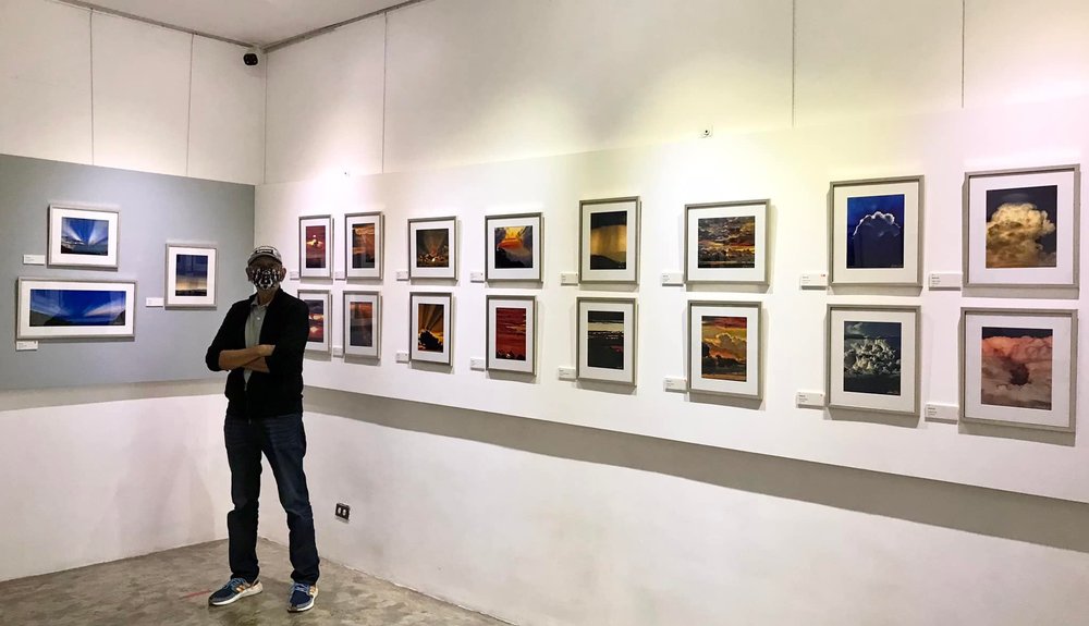 Ben Cab with his artwork/paintings