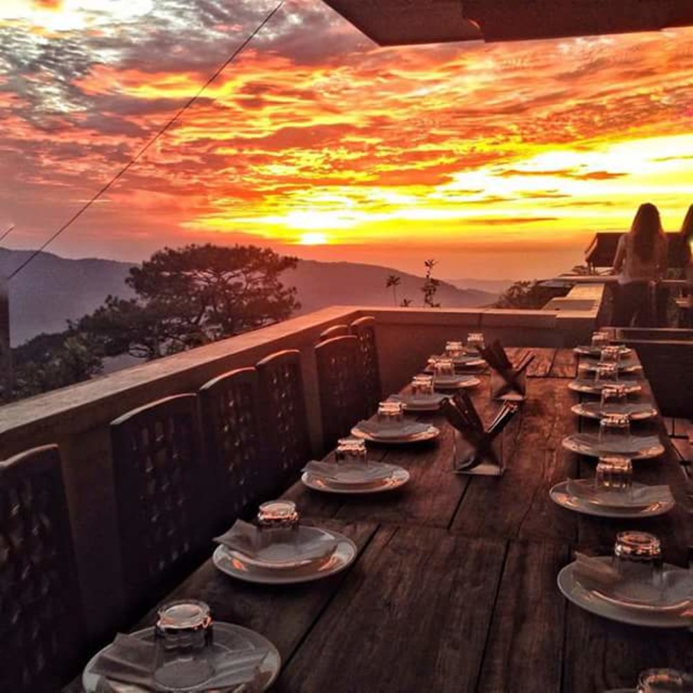 Sunset dinner in a foggy mountain restaurant
