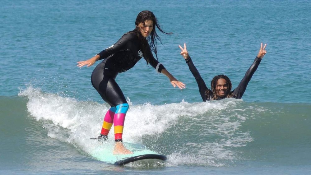Ride the waves at Kuta Beach, one of Bali’s most famous tourist spots.