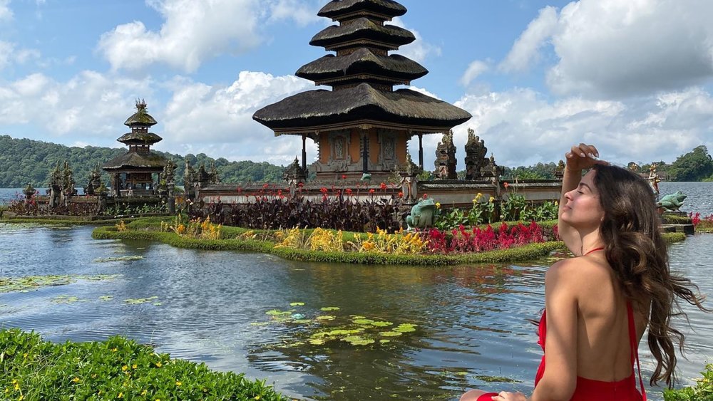 Enjoy the peaceful atmosphere at the Ulun Danu Temple, which is dedicated to the gods Brahma, Vishnu, and Shiva. Credit: rossapg