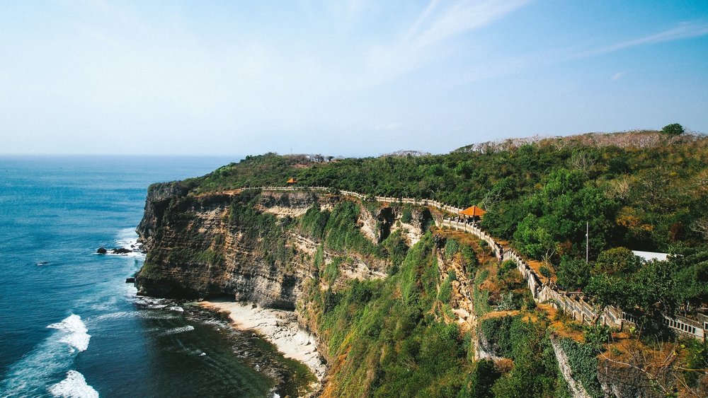 Uluwatu Cliff is one of the most famous sunset spots in Bali.  Credits:  @bckfwd on Unsplash