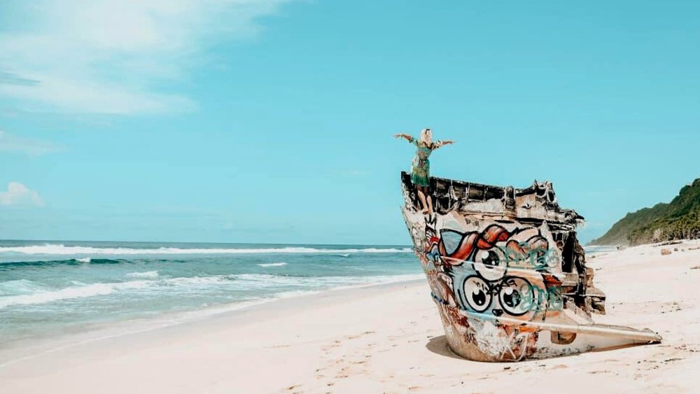 Get creative on the painted Shipwreck in Nunggalang Beach Credits: @teddy_kurniawan7 on Instagram