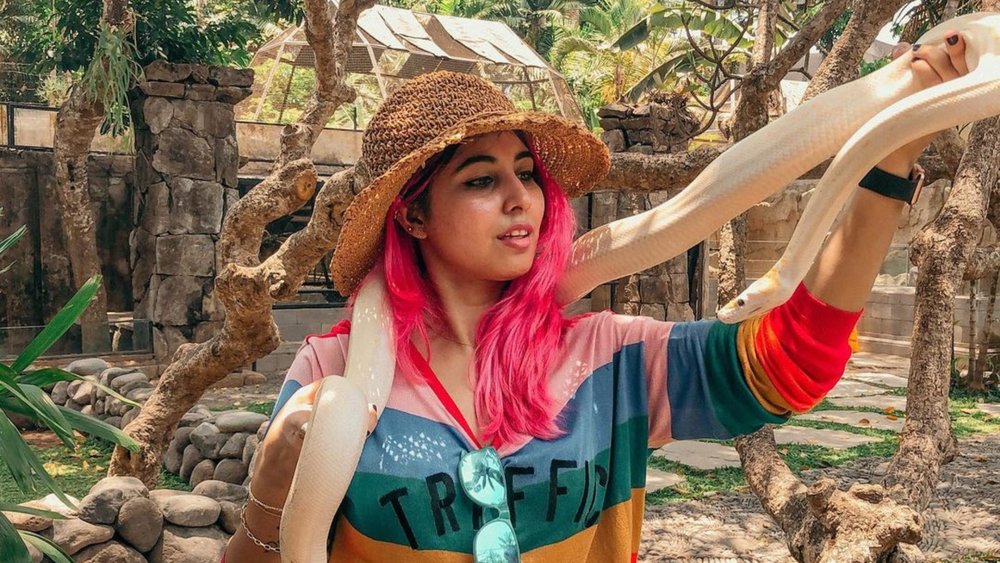 Are you brave enough to take a photo with the python?  Image credits: @suboohiikhan on Instagram