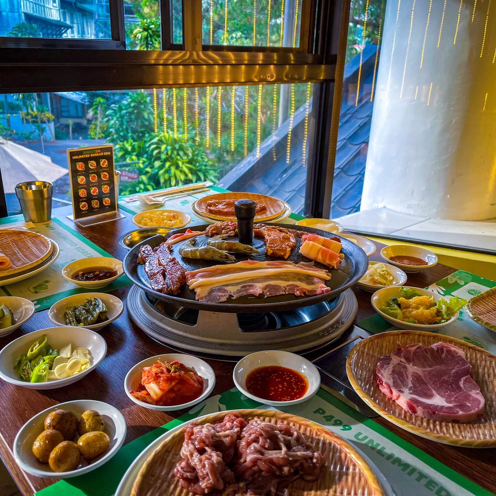 Samgyupsal with different kind of meat and side dishes