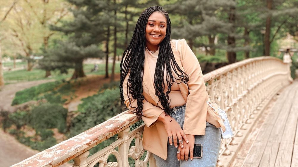Girl smiling for a photo at Central Park