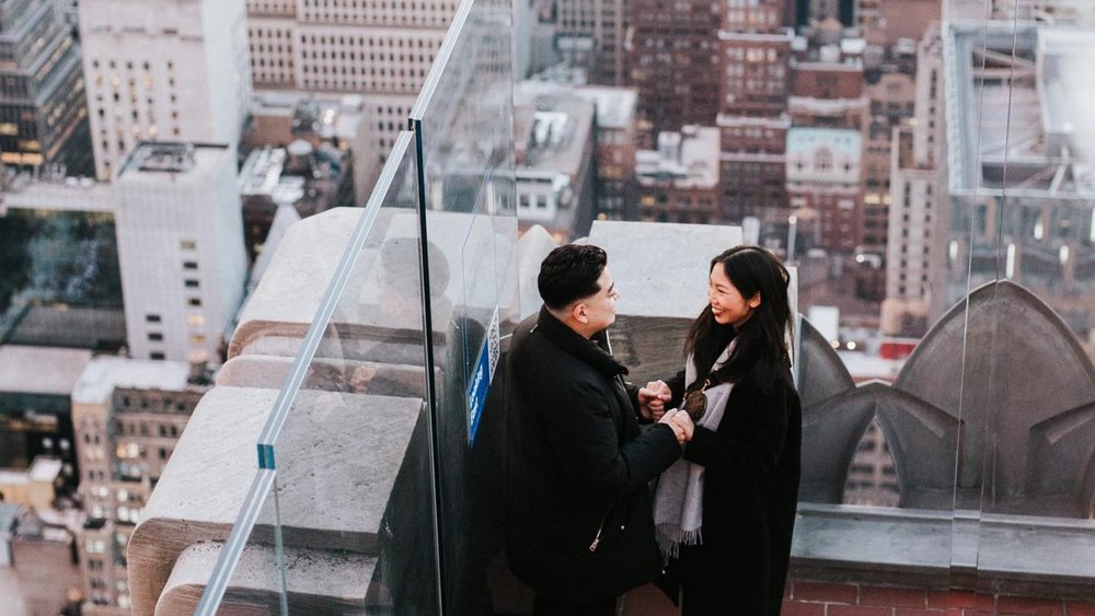 Candid photo of a happy couple at Top of the Rock