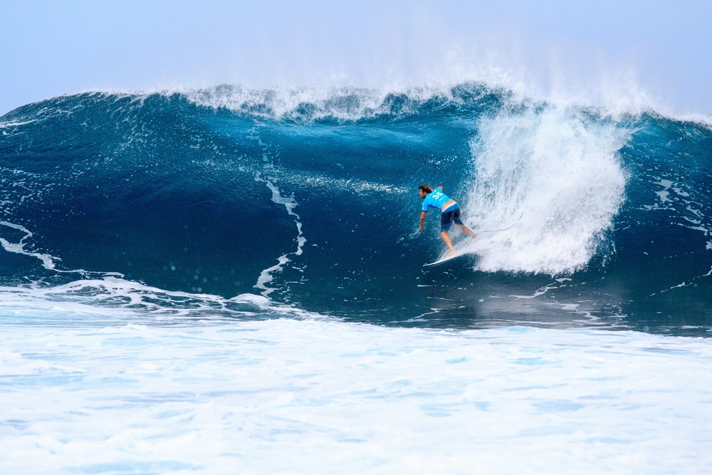 man surfing in banzai pipeline