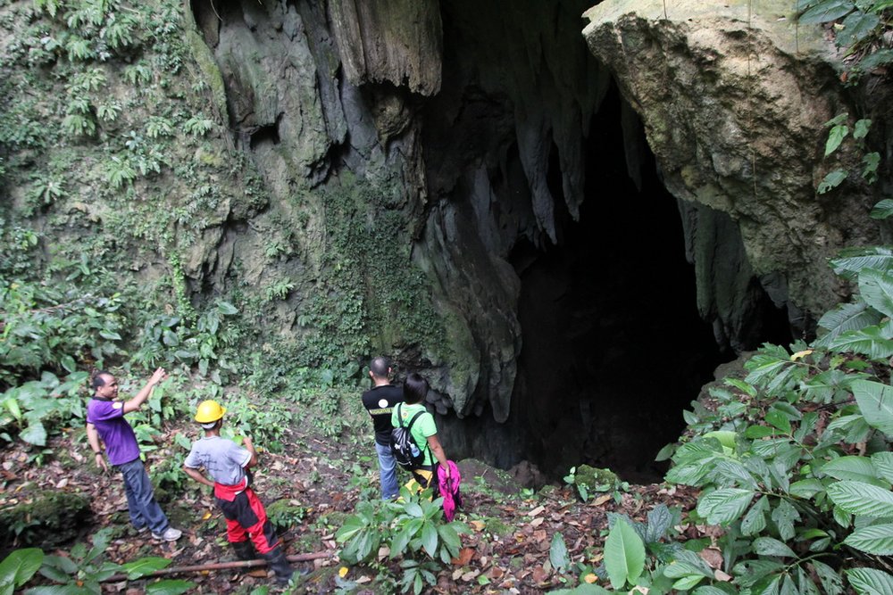 People going inside the cave