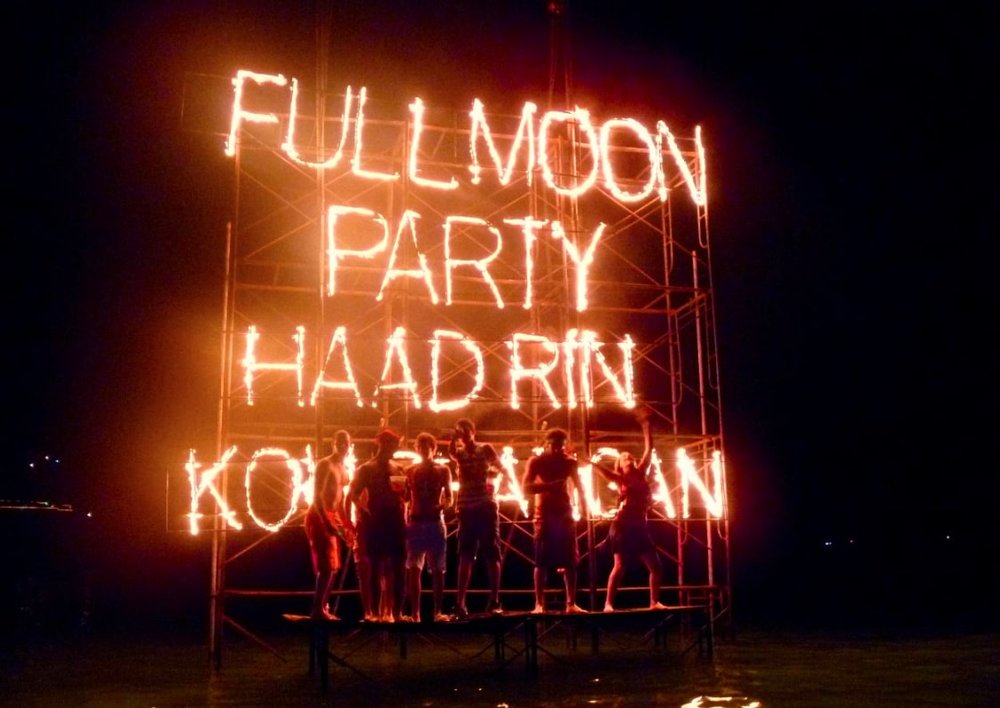 partygoers at koh pangan beach at night