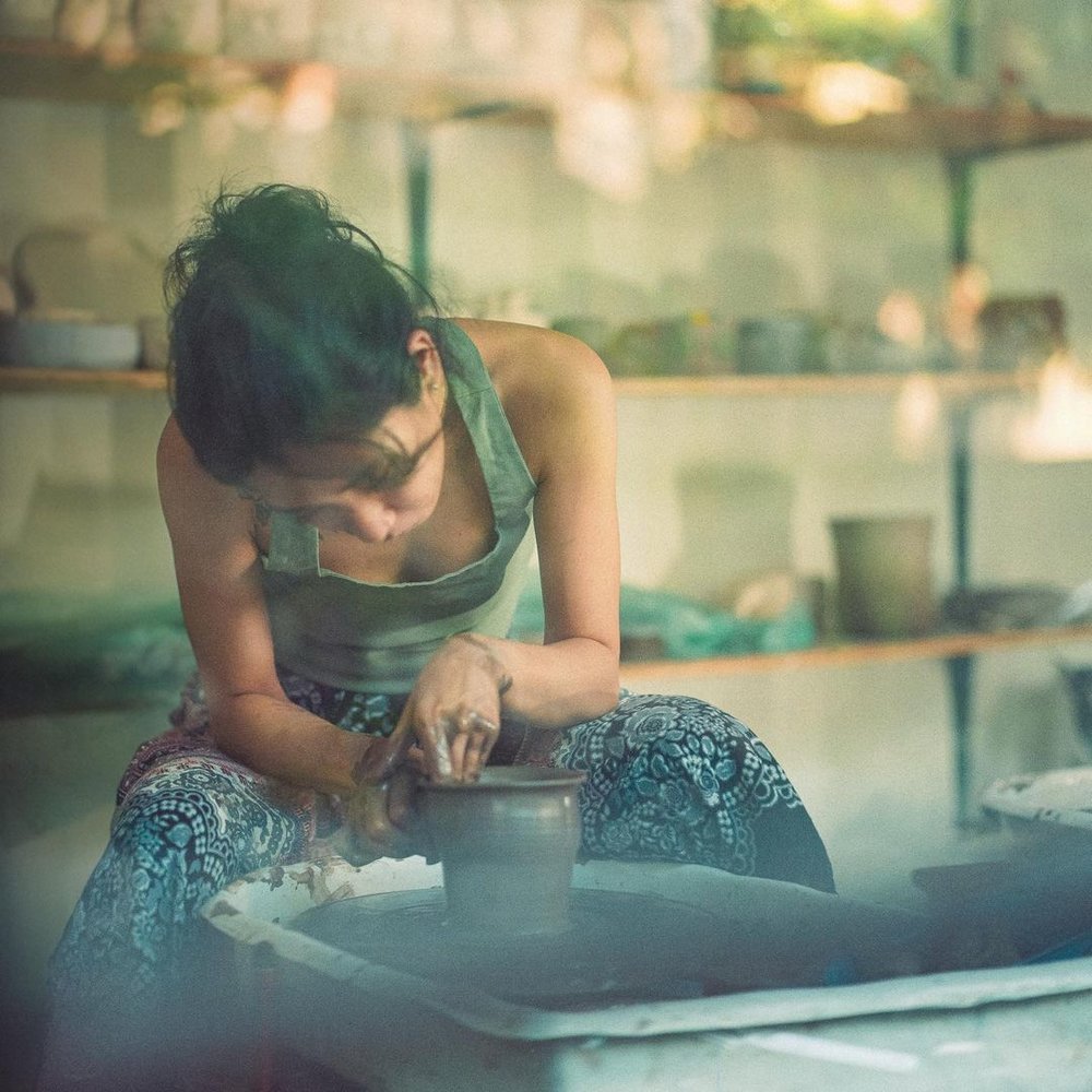 girl doing pottery