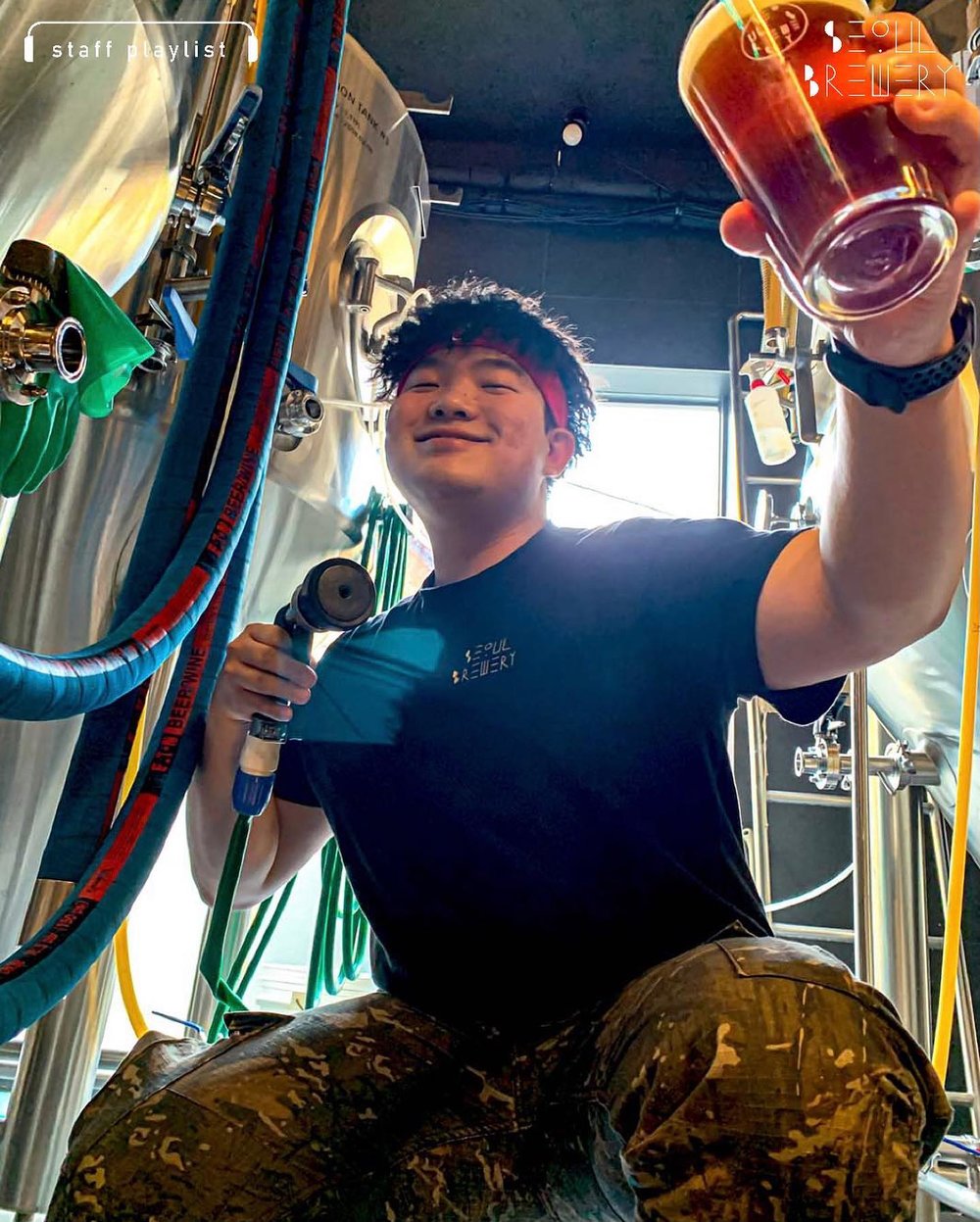 Staff holding beer pump