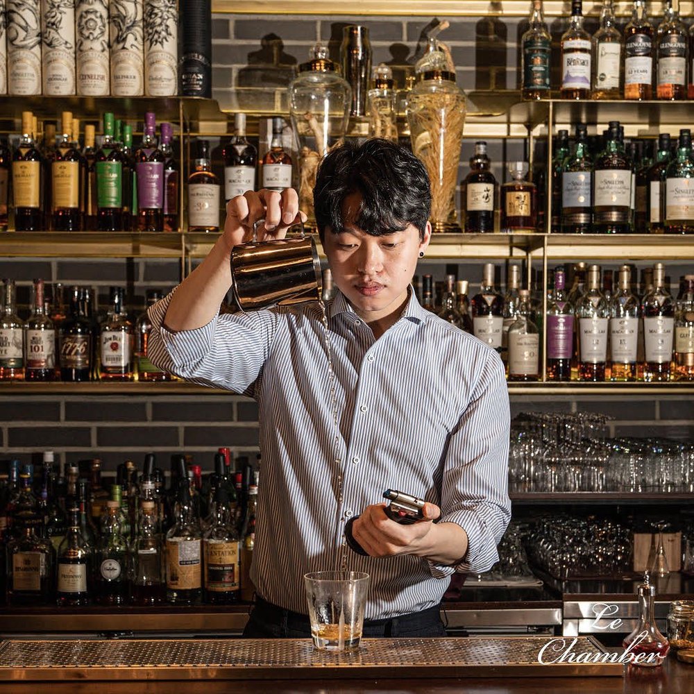 Bartender mixing drinks
