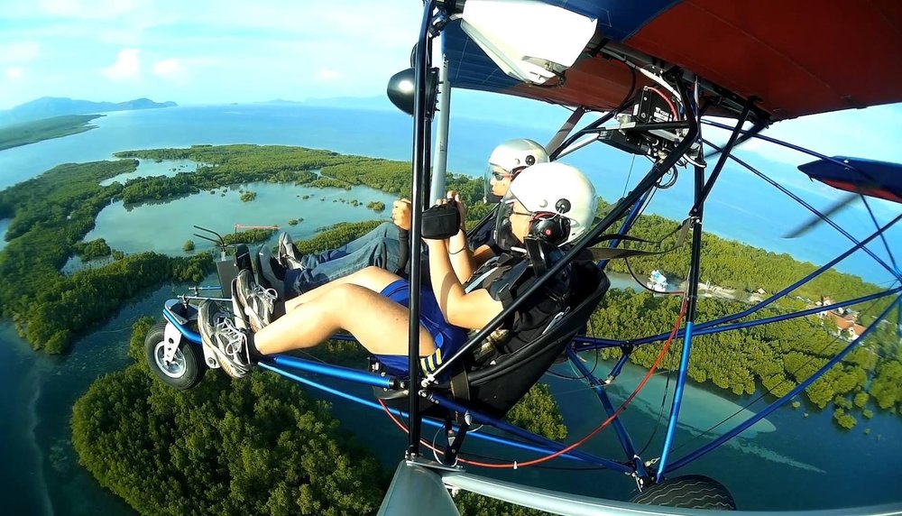 Two people flying above Mati City