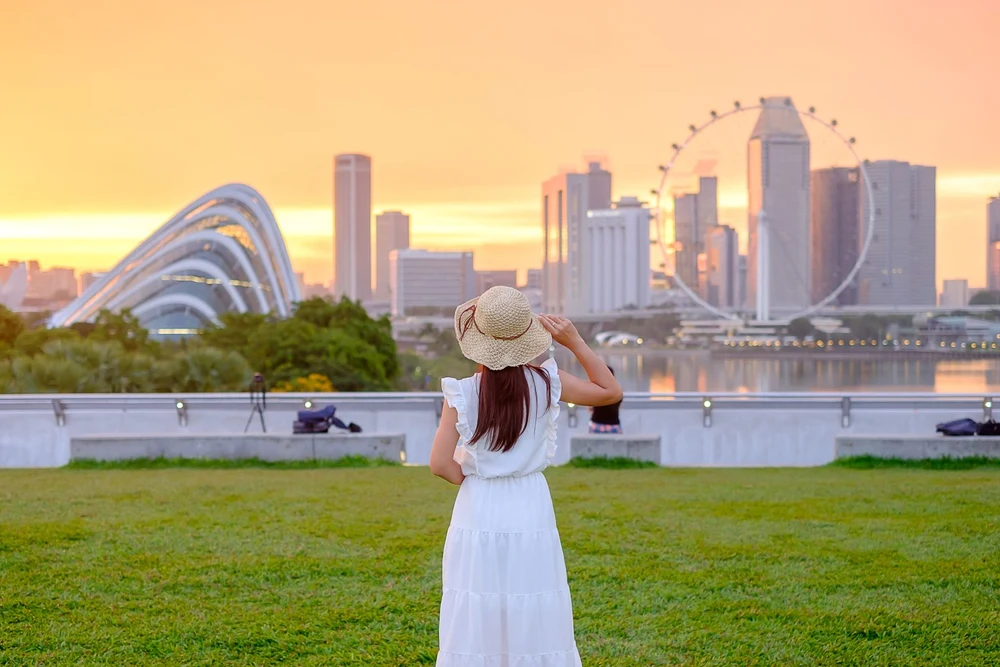 A woman standing on the Marina Barrage Singapore