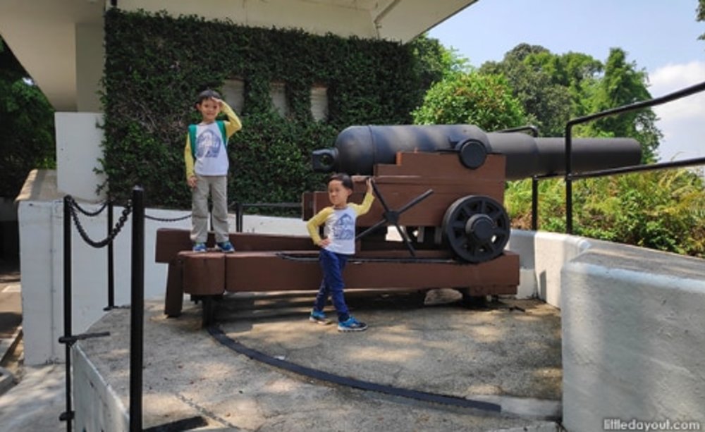 two boys playing around in fort siloso