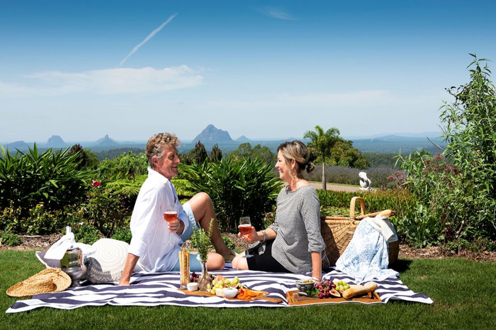 Man and woman having a picnic at Maleny Botanic Gardens