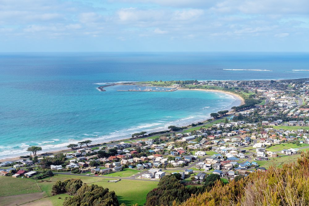 a panoramic view of the sea and Apollo Bay from a hill