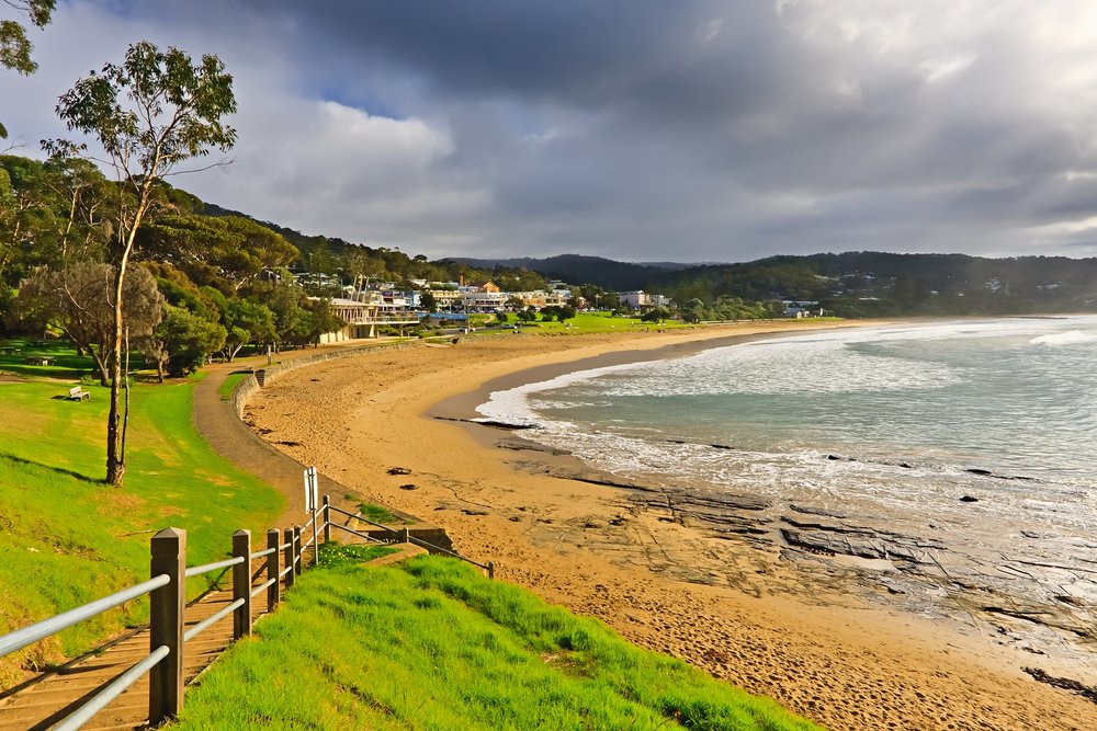 a view of the beach and some houses in Port Campbell