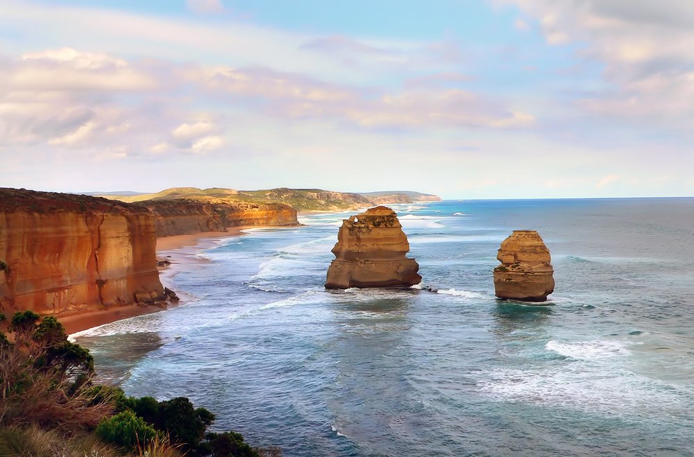 a view of the Twelve Apostles and the ocean from a cliff