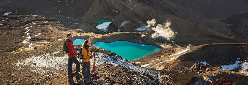 Hiker on top of mountain in New Zealand