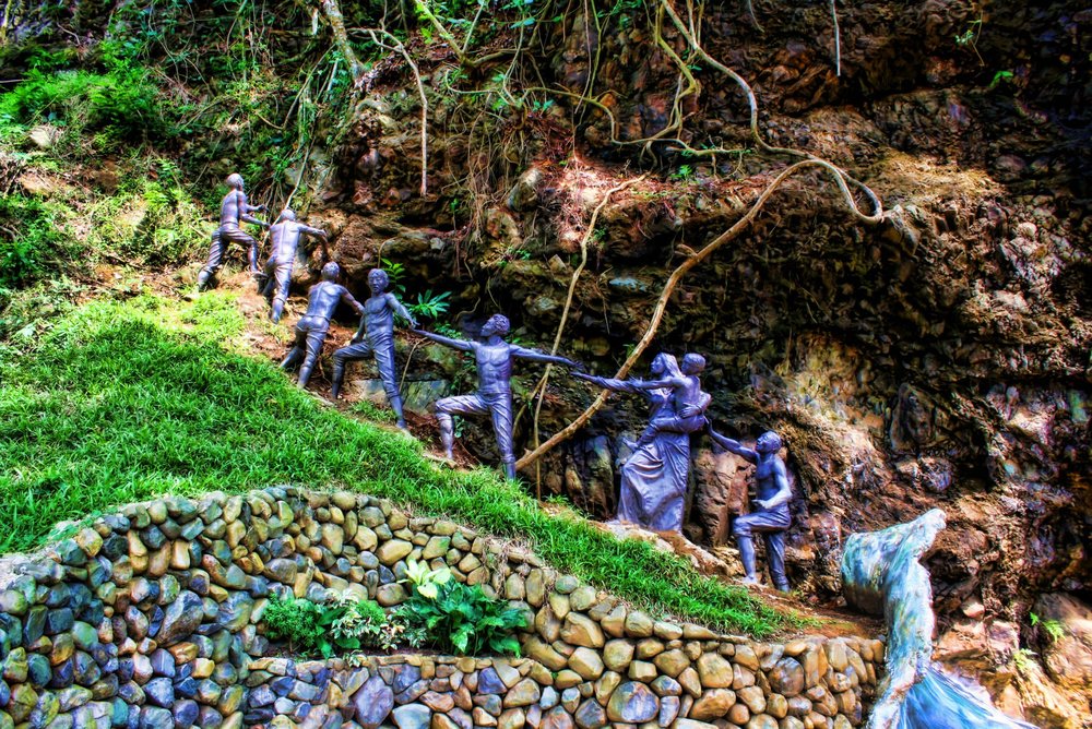 Kids statue climbing the hills in Baler