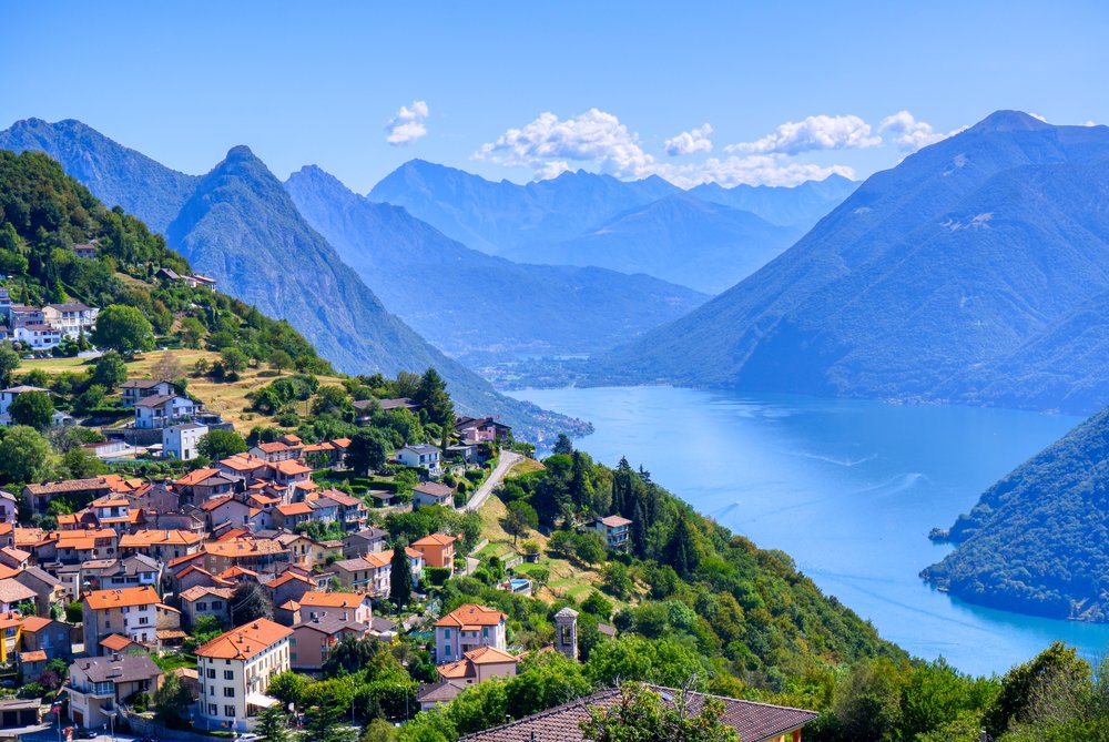 View of houses, mountains, and the sea in Lugano