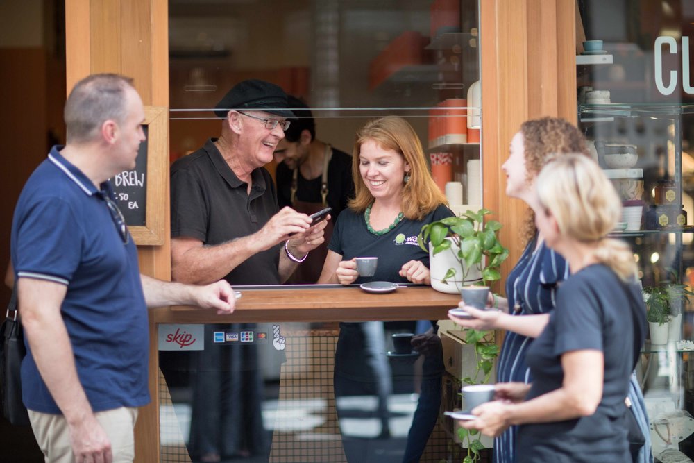 small group of people enjoying coffee in Melbourne