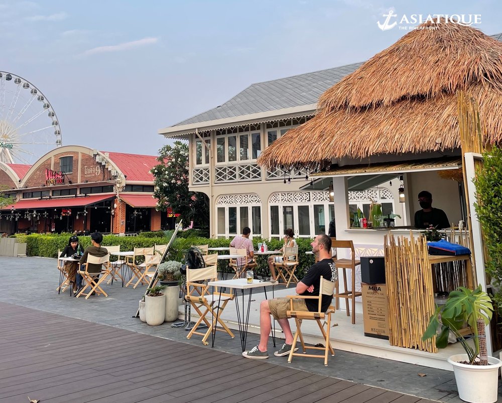 in front of a cafe in Asiatique: The Riverfront
