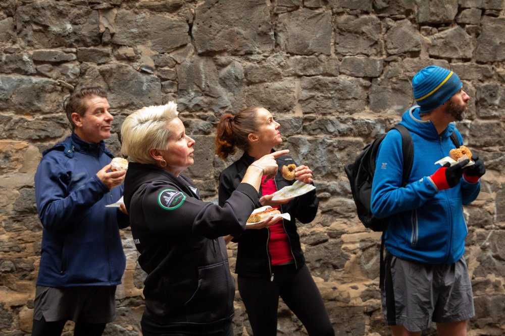 people enjoying donuts while learning about Melbourne's history