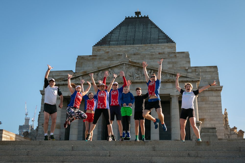 people in jogging outfits in front of the Shrine of Remembrance Melbourne