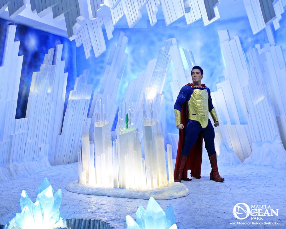 Superman standing in a middle of a snow cave