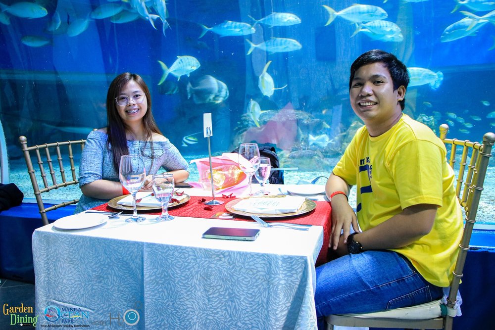 Couple dining with aquarium view