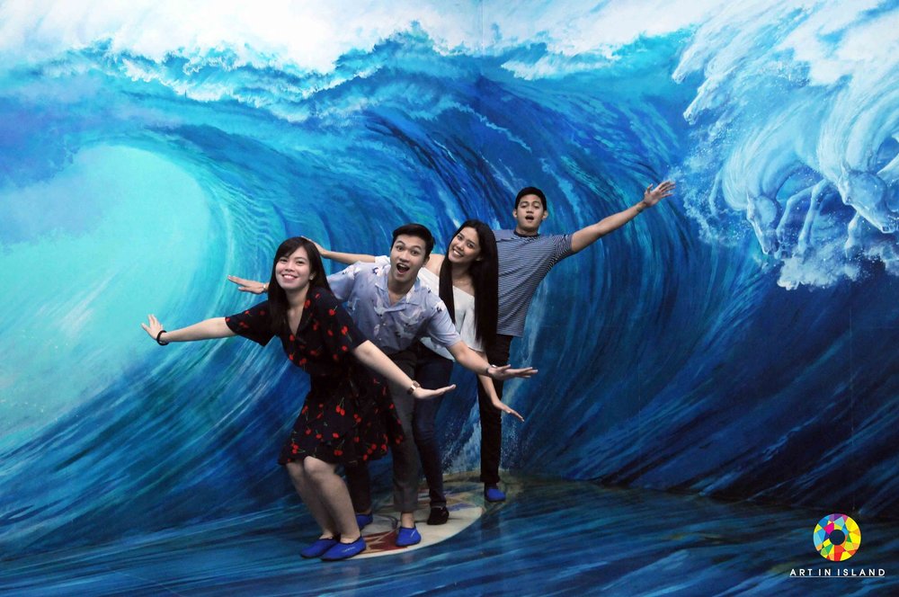 Group of friends riding a wave