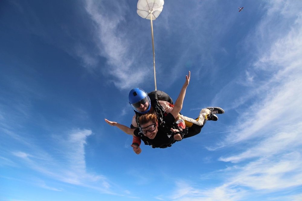 Girl smiling while sky diving