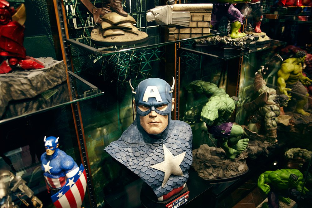 Different superhero figures on display inside Figure Museum W