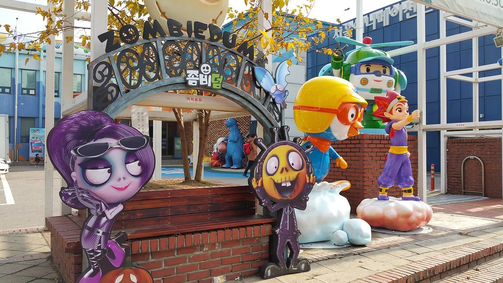 Different animated character standees and figures on display