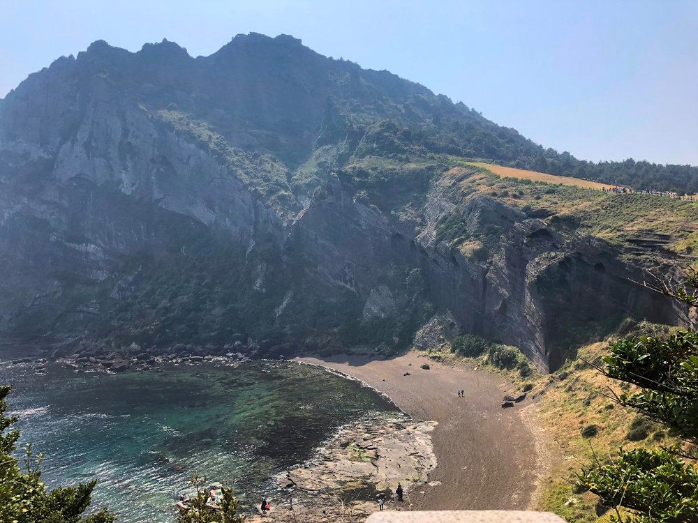 Mountains, a road, and the sea