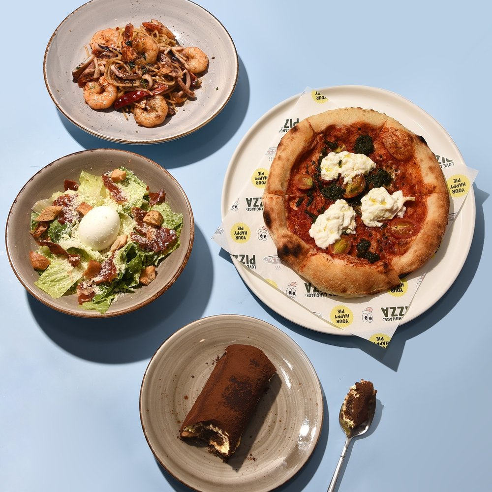Pasta, salad and a chocolate dessert in the table