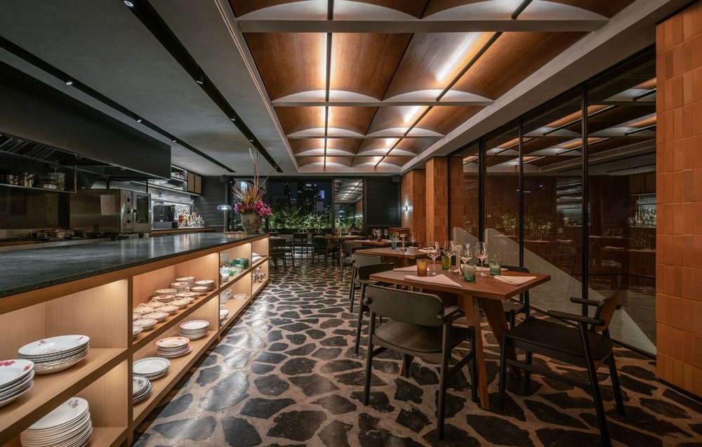 Aksorn restaurant interior with black and wooden theme
