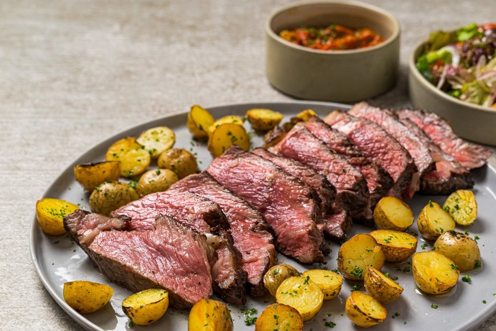 Steak with mini baked potatoes in the side